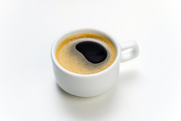Coffee cup espresso on white kitchen table. Coffee cup closeup. Morning, breakfast, energy, coffee break concept