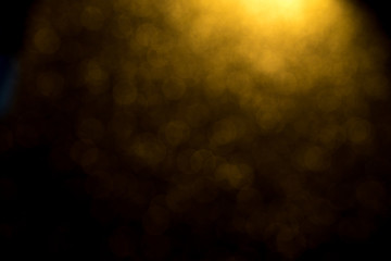 Golden bokeh mistical abstract background. Defocused light.