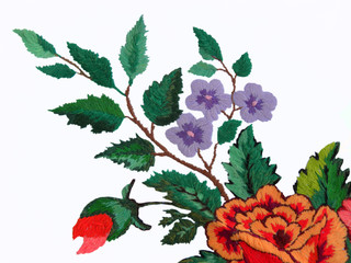 embroidered flowers on a white background, ethnic fabric decor, Ukrainian folk embroidery