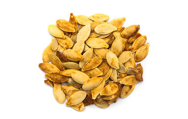 crispy home made pumpkin seeds baked isolated on white