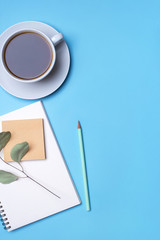 Flat lay photo of a freelancer workspace desk. Top view.