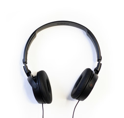 Fototapeta na wymiar Classic black wired headphones on white background. Minimalistic music concept
