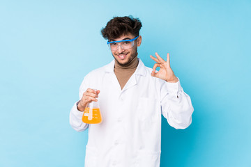 Young arab scientific man isolated cheerful and confident showing ok gesture.