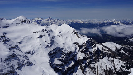 Snowy swiss alps view in high elevation sky