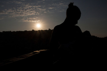 silhouette of a woman with baby