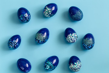 Beautiful Easter blue background with blue decorative eggs.