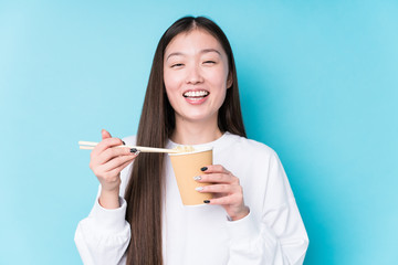 Young japanese woman eating noodles