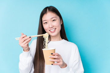 Young japanese woman eating noodles