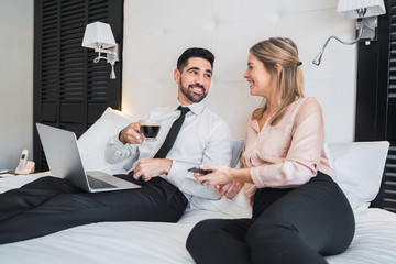 Two business people working together on laptop.