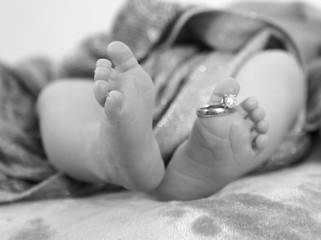 Baby feet and Mommies ring