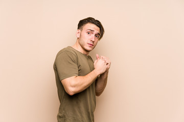 Young caucasian man posing isolated scared and afraid.