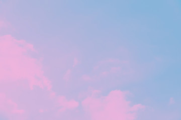 Light pale blue sky with pink clouds. Beautiful sky background