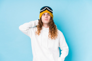 Young caucasian man wearing a ski clothes isolated  touching back of head, thinking and making a choice.