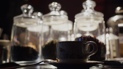 Silhouette of cup of tea on background with tea glass bulbs