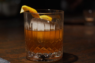 Alcohol cocktail with orange peel