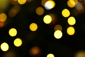 Long exposure blurred yellow christmas tree lights abstract background