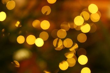 Long exposure blurred yellow christmas tree lights abstract background