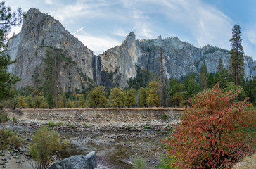 View of Yosemite Waterfall On Large Peak With Stream in the Foreground During Fall Season