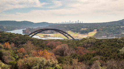 View of of Metal Bridge outside of Austin Texas, with Skyline in the Background