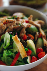 Salad with chicken, cucumbers, tomatoes, peppers, lettuce