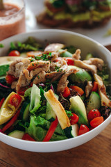 Salad with chicken, cucumbers, tomatoes, peppers, lettuce