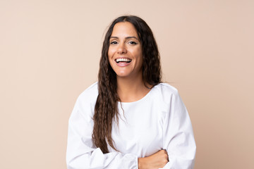 Young woman over isolated background laughing