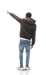 casual guy in black jacket looking at white wall