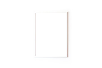 Blank white square frame in front of white wall 