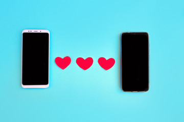 Hearts and smartphone. Concept to like in social networks or Dating app
