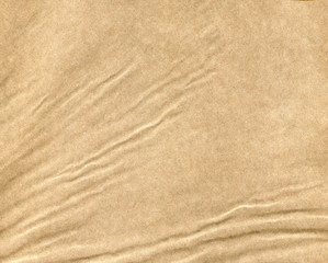 Fototapeta na wymiar Kraft paper crumpled shape. Natural condition. Paper texture. For the background.