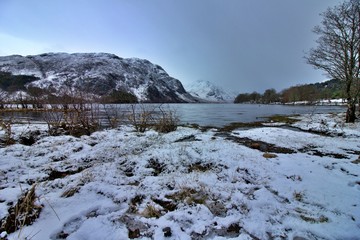 Scotland winter landscape with lake and snow
