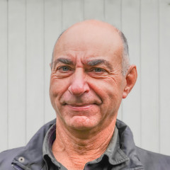 Portrait of an elderly bald man