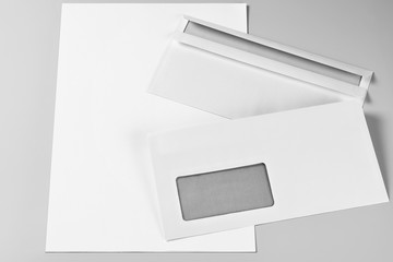 Two Envelopes over Blank Sheets of Paper