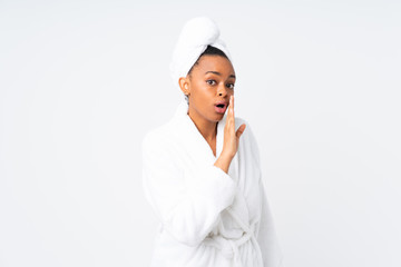 African american woman  in a bathrobe over isolated background whispering something