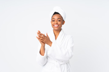 African american woman  in a bathrobe over isolated background applauding