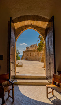 Look through open doors of church in castle of capdepera