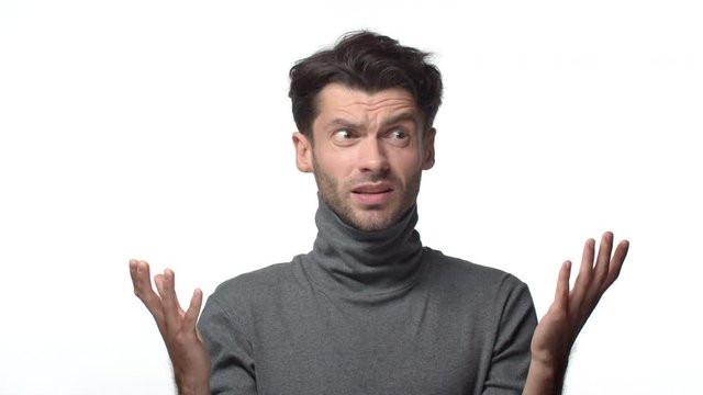 What hell happening. Slow-motion confused and frustrated bothered handsome businessman seeing huge mess at work, raising hands in dismay shrugging and freak-out of nonsense, white background