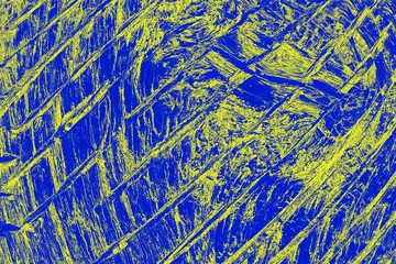 Bright blue and yellow background with streaks. Wooden texture, cracked pattern. Abstract background