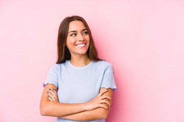 Fototapeta premium Young caucasian woman wearing a ski clothes isolated smiling confident with crossed arms.