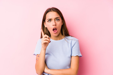 Fototapeta premium Young caucasian woman wearing a ski clothes isolated having an idea, inspiration concept.