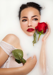 milky bath and red rose - 313335983