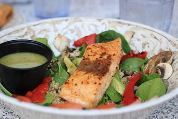 grilled salmon steak with vegetables and sauce