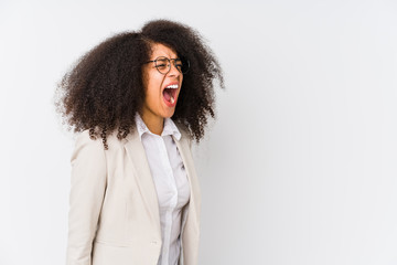 Young african american business woman shouting towards a copy space