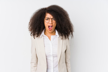 Fototapeta premium Young african american business woman screaming very angry and aggressive.