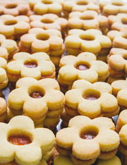 Flower shaped homemade cookies filled with jam