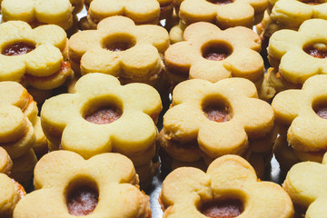 Flower shaped homemade cookies filled with jam