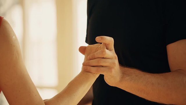 close-up of the legs of a man and a woman dancing a pair of ballroom dance in the room. Dance moves of the tango, Latinos, the Paso Doble. Gait.