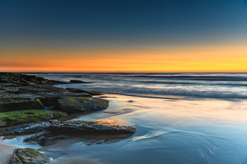 Fototapeta na wymiar Sunrise Seascape with Soft Cloud on the Horizon