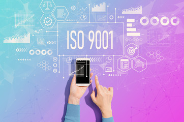 ISO 9001 concept with person using a white smartphone