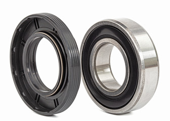 Ball bearing and oil seal for machine repair, isolated on white background